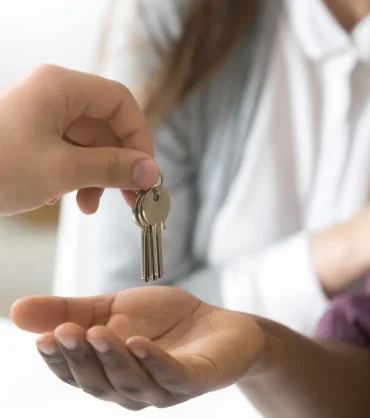 realtor-giving-african-customer-keys-couple-buying-new-house-closeup realtor-giving-african-customer-keys-couple-buying-new-house-closeup